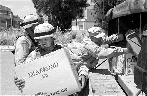 101st Airborne troopers deliver computer equipment to Iraq’s Mosul University, 21 May 2003. The equipment was donated by the Division’s 159th Aviation Brigade.